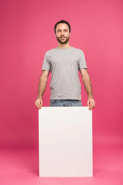 Handsome Man Posing Empty Board Isolated Pink — Free Stock Photo