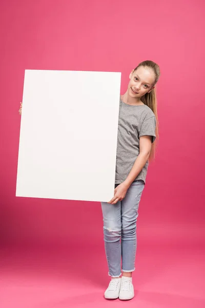 Blonde Female Kid Posing Empty Board Isolated Pink — Free Stock Photo