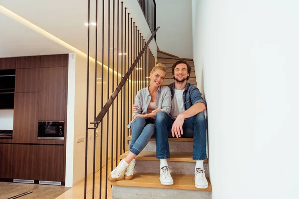 Handsome Man Sitting Stairs Embracing Attractive Wife Home — Stock Photo, Image