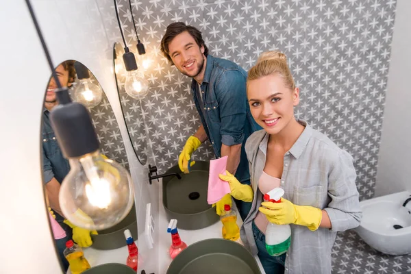 Handsome Man Beautiful Girl Cleaning Mirrors Looking Camera Bathroom — Stock Photo, Image