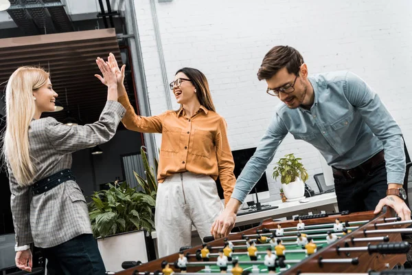 Business Colleagues Playing Table Football Together Office — Free Stock Photo