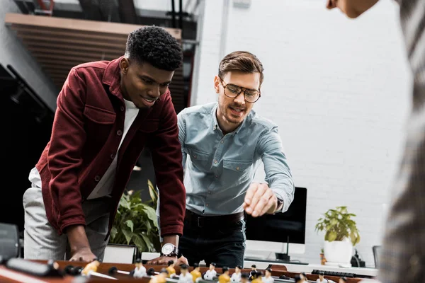 Multiracial Business Colleagues Playing Table Football Together Office — Free Stock Photo