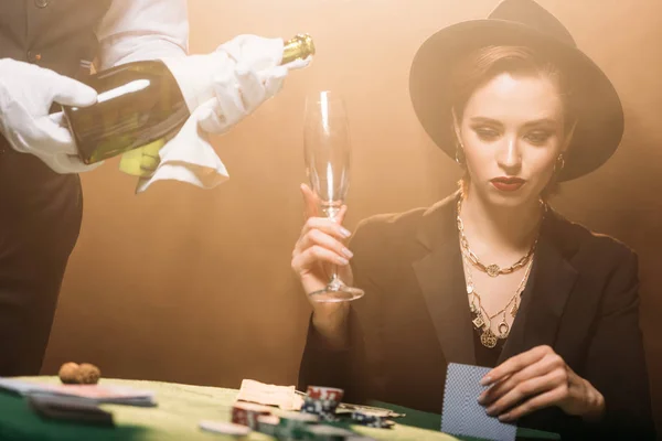 Waiter Pouring Champagne Glass Attractive Girl Jacket Hat Casino She — Stock Photo, Image