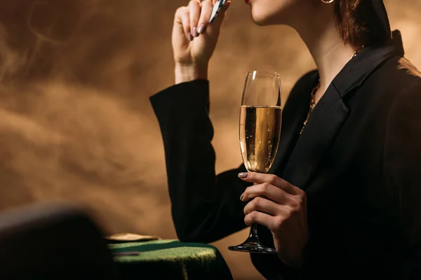 Cropped Image Girl Jacket Hat Holding Glass Champagne Poker Chips — Free Stock Photo