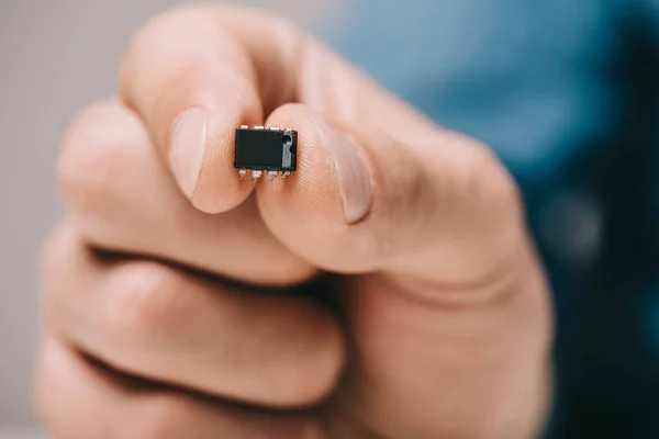 Selective Focus Man Holding Black Metallic Microchip — Stock Photo, Image