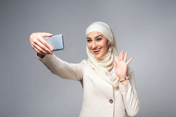Happy Young Muslim Woman Taking Selfie Smartphone Isolated Grey — Stock Photo, Image