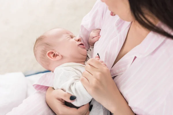 Partial View Mother Calming Little Crying Baby Hands — Stock Photo, Image