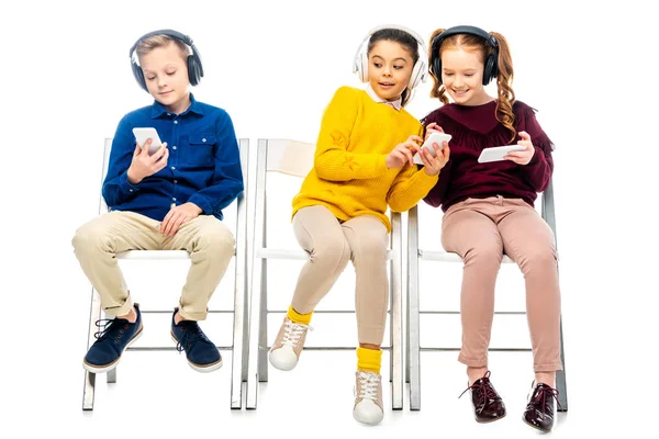 Schoolgirl Showing Smartphone Screen Friend Quietly Boy Sitting Nearby Isolated — Stock Photo, Image