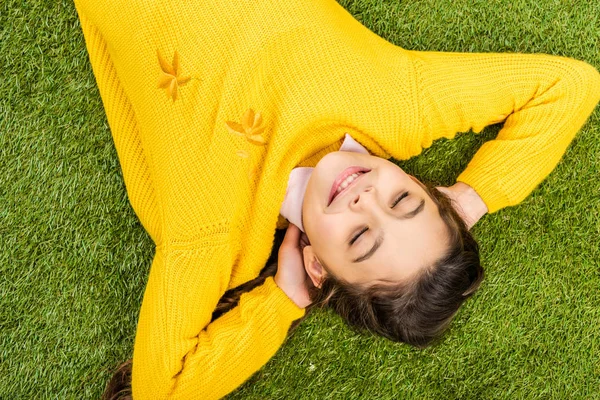 Top View Cute Schoolgirl Yellow Sweater Lying Lawn Closed Eyes — Stock Photo, Image