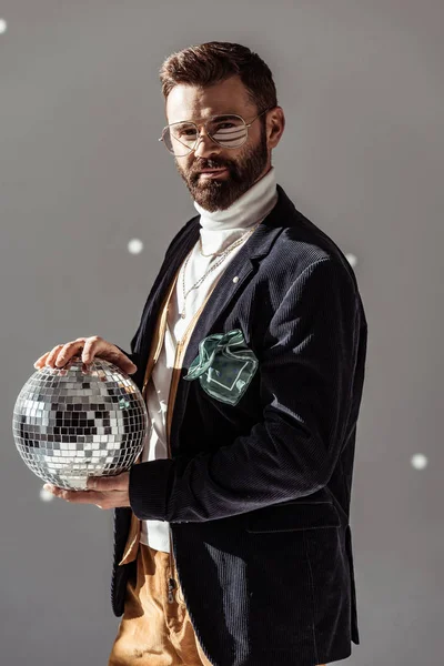 Handsome Man Glasses Holding Disco Ball Looking Camera Grey Background — Stock Photo, Image