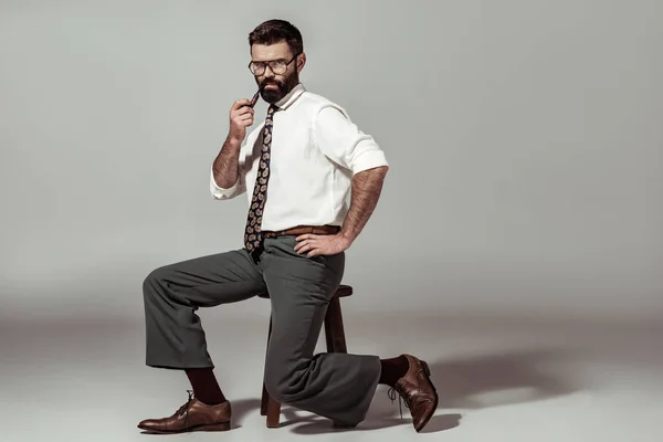 Handsome Bearded Man Pipe Sitting Chair Looking Camera — Stock Photo, Image