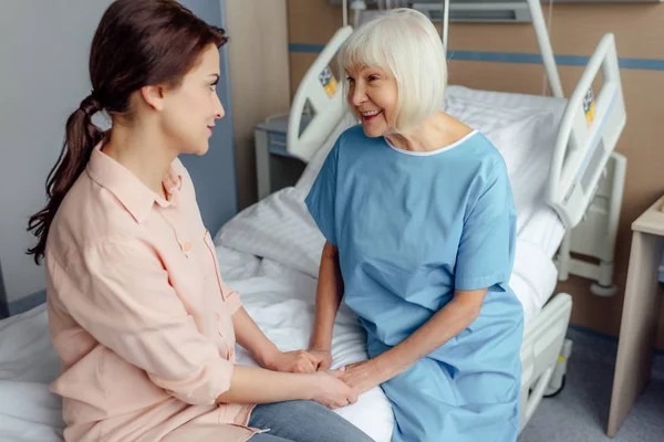 Senior Woman Daughter Sitting Bed Holding Hands Hospital — Stock Photo, Image