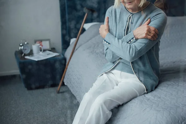 Cropped View Lonely Senior Woman Sitting Bed Hands Crossed Home — Stock Photo, Image