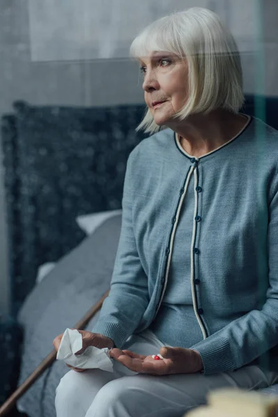 Sad Senior Woman Sitting Bed Holding Handkerchief Pills Home — Stock Photo, Image