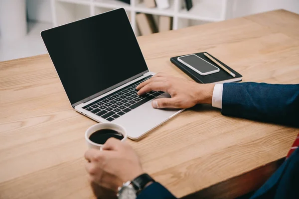 Cropped View Businessman Holding Cup Coffee While Typing Laptop Workplace — Stock Photo, Image