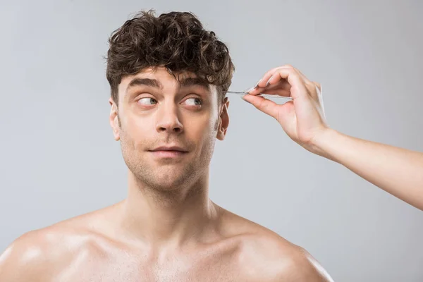 Female Hand Plucking Hair Tweezers Male Eyebrows Isolated Grey — Stock Photo, Image