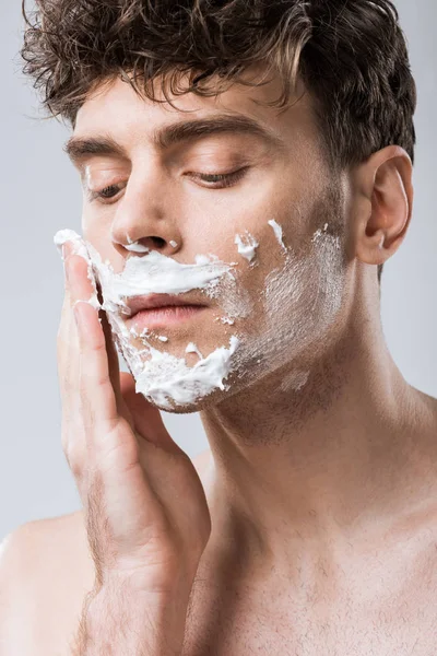 Close Young Man Applying Shaving Foam Face Isolated Grey — 图库照片