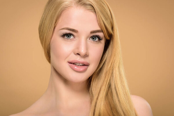 Studio shot of blonde young woman with grey eyes 