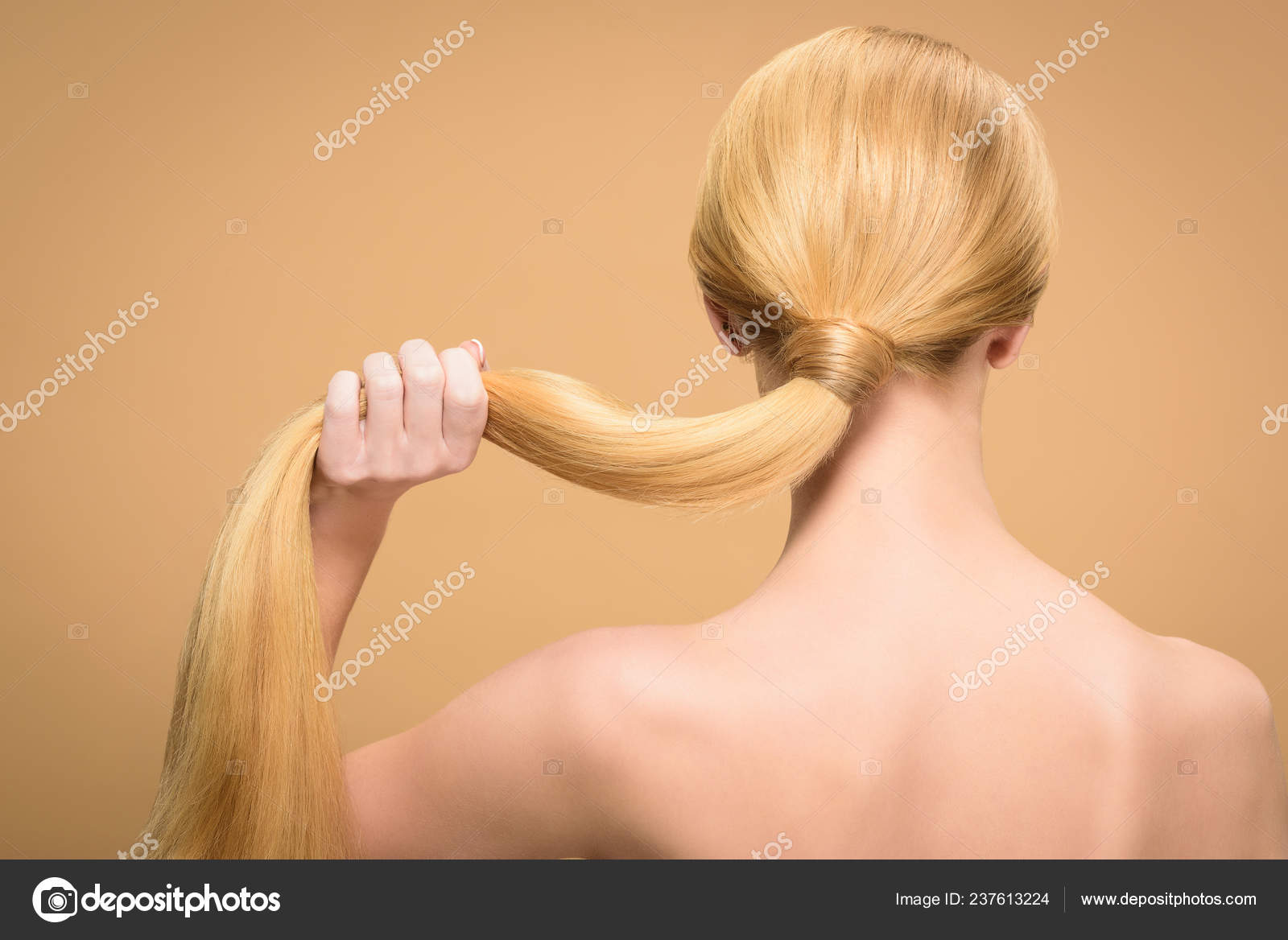 Back View Naked Blonde Woman Holding Long Straight Hair Isolated