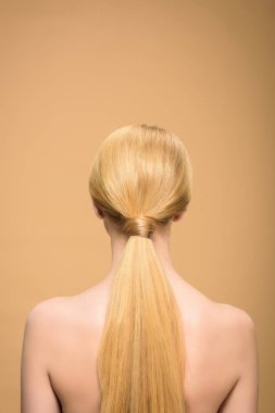 back view of naked blonde girl with long straight hair isolated on beige clipart
