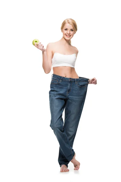 Menina Magro Feliz Jeans Oversized Segurando Maçã Sorrindo Para Câmera — Fotografia de Stock