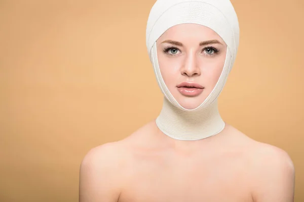 Naked Young Woman Bandages Head Looking Camera Isolated Beige — Stock Photo, Image