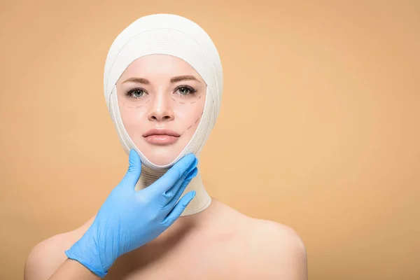 Doctor Latex Glove Touching Face Young Woman Bandages Head Isolated — Stok fotoğraf