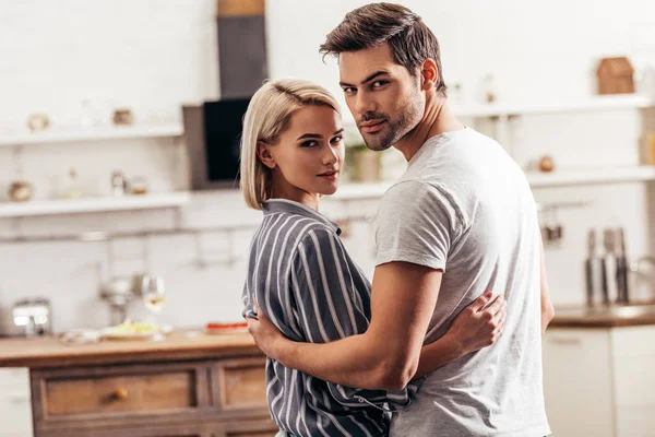 Selective Focus Handsome Boyfriend Attractive Girlfriend Hugging Standing Kitchen While — Stock Photo, Image