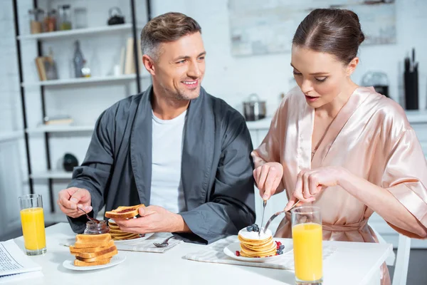 Beautiful Adult Couple Robes Breakfast Pancakes Orange Juice Kitchen — Stock Photo, Image