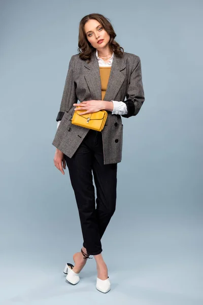 Beautiful Stylish Woman Formal Wear Holding Bag Posing Grey Background — Stock Photo, Image