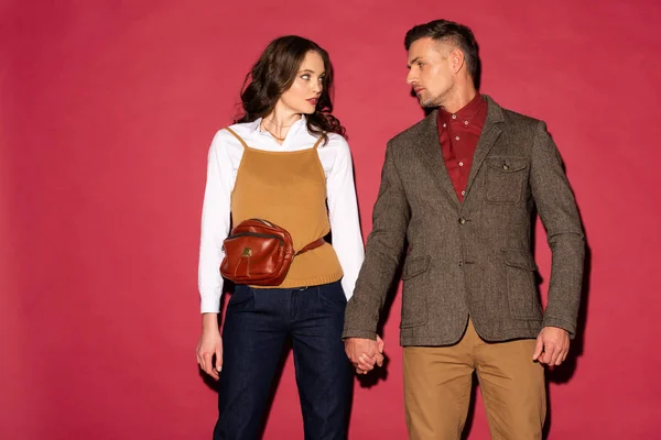 Beautiful Fashionable Couple Formal Wear Holding Hands Posing Red Background — Stock Photo, Image