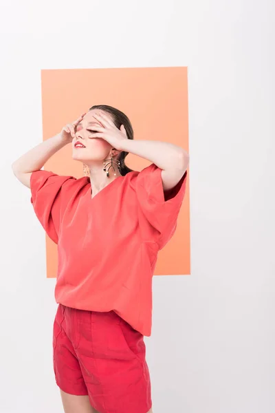 Beautiful Fashionable Girl Touching Face Posing Living Coral Background — Stock Photo, Image