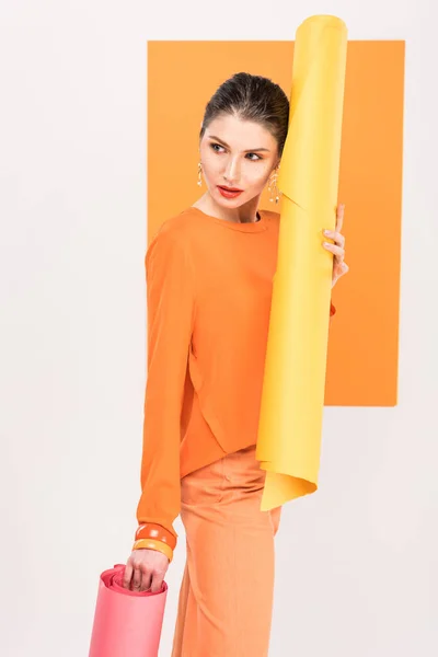 Beautiful Stylish Young Woman Holding Paper Rolls Posing Turmeric Background — Stock Photo, Image