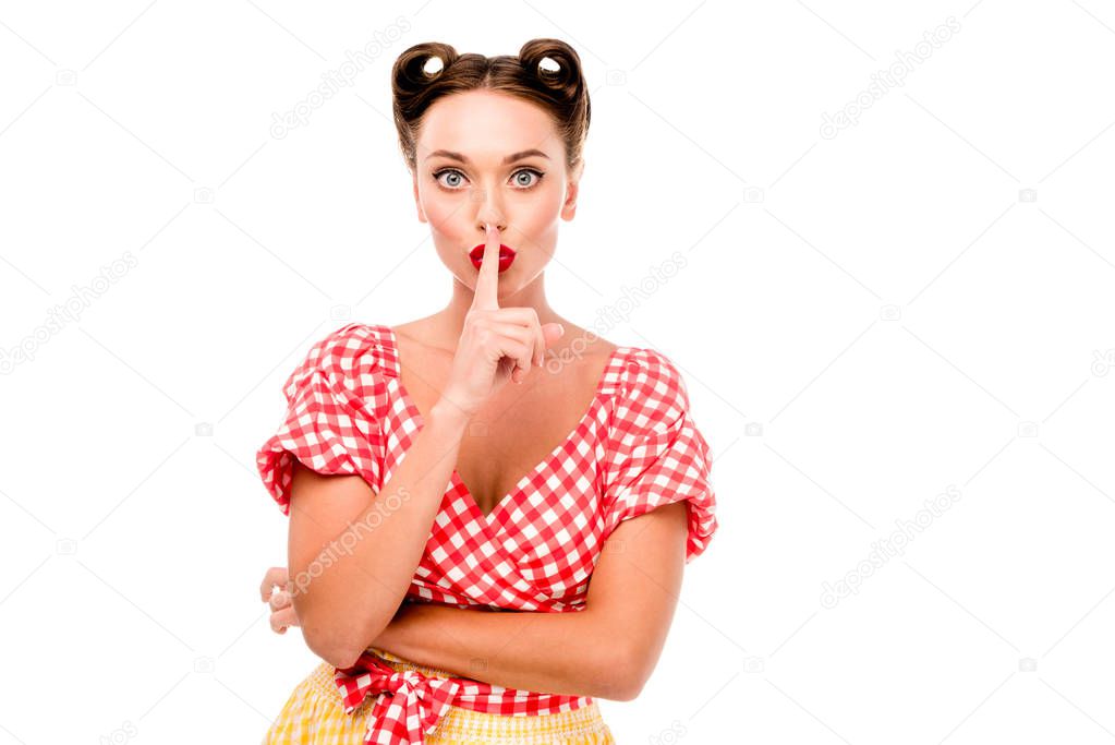 Pin up girl in retro clothes showing silence sign isolated on white