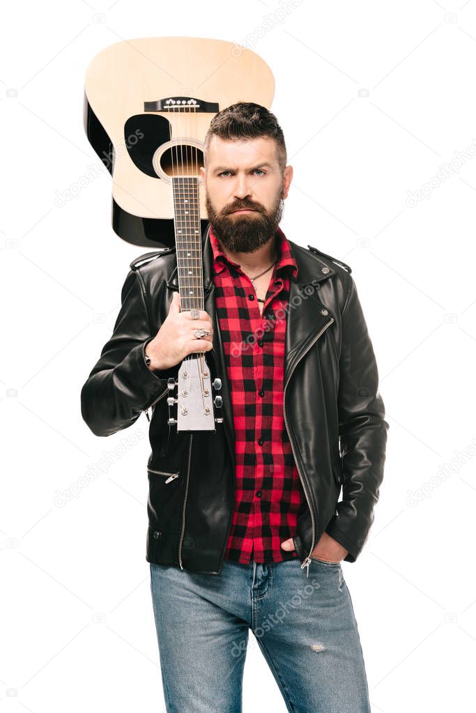 handsome rocker in black leather jacket holding acoustic guitar, isolated on white