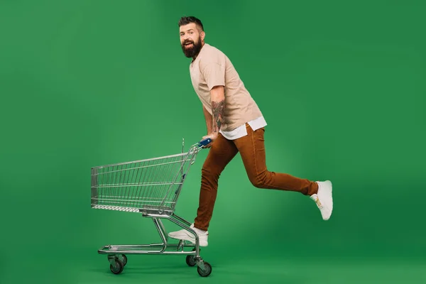 Bearded Man Riding Shopping Cart Isolated Green — Stock Photo, Image