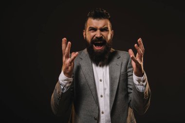 aggressive beard businessman gesturing and screaming isolated on brown clipart