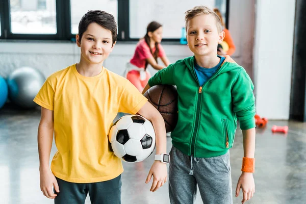 Smiling Boys Holding Balls Looking Camera — Stok Foto