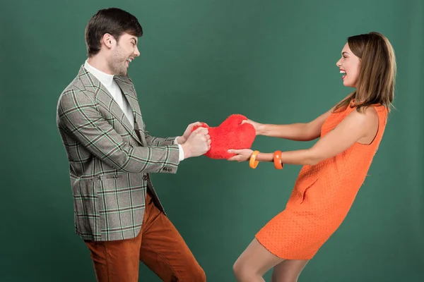 Beautiful Couple Holding Heart Shaped Pillow Isolated Green — Stock Photo, Image