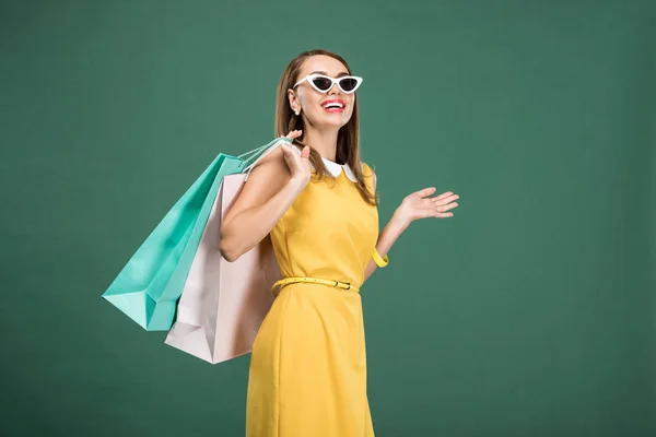 Happy Stylish Woman Yellow Dress Sunglasses Shopping Bags Isolated Green — Stock Photo, Image