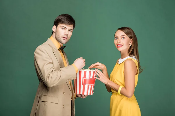 Beautiful Couple Vintage Clothes Watching Movie Popcorn Isolated Green — Stock Photo, Image