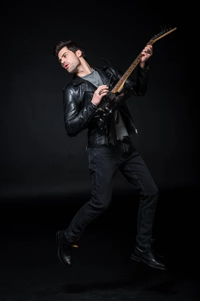 Handsome Rocker Leather Jacket Playing Electric Guitar Isolated Black — Stock Photo, Image