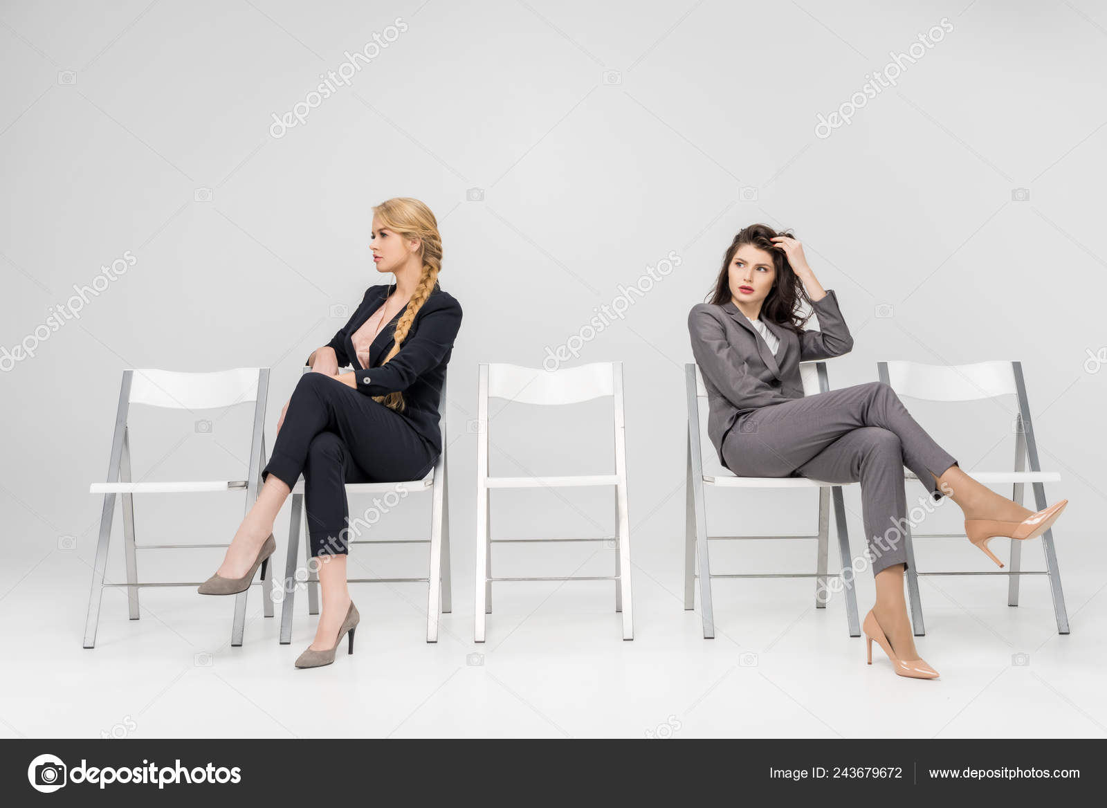 Women Sitting Crossed Legs Chairs Isolated Grey — Stock