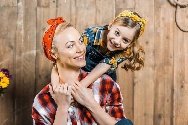 Adorable Daughter Hugging Cheerful Mother Wooden Fence — Stock Photo, Image