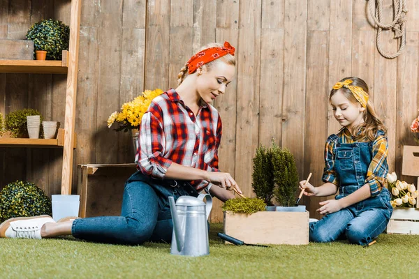 Mother Planting Flowers Daughter While Sitting Grass Wooden Fence — Stock Photo, Image