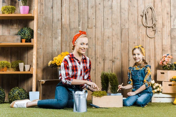 Mother Planting Flowers Cute Daughter While Sitting Grass Wooden Fence — Stock Photo, Image