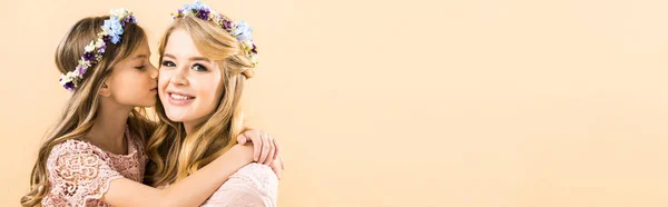 Adorable Daughter Kissing Hugging Beautiful Mother Yellow Background — Stock Photo, Image