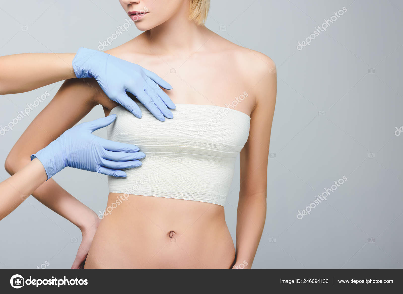 Cropped View Plastic Surgeon Checking Female Breast Bandage Isolated