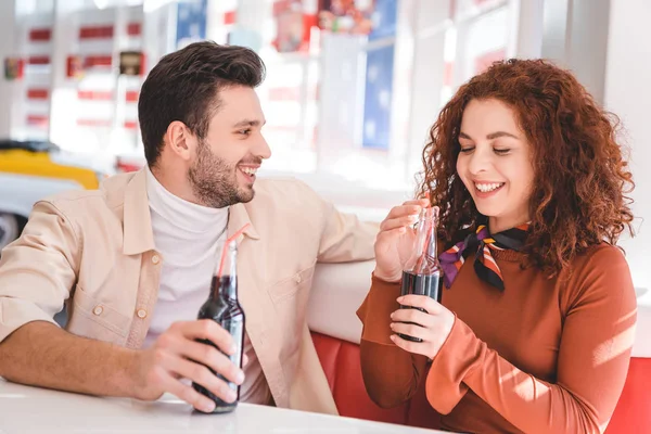 Couple Smiling Holding Glass Bottles Soda Cafe — Stock Photo, Image