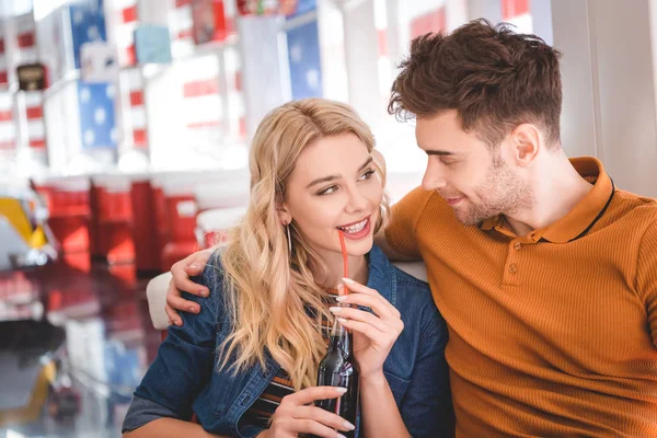 Beautiful Woman Holding Glass Bottle Soda Hugging Man Cafe — Stock Photo, Image